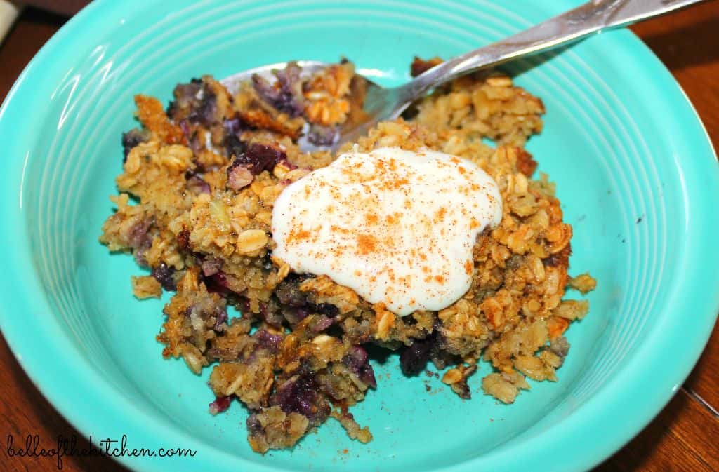 A bowl of oatmeal with yogurt on top