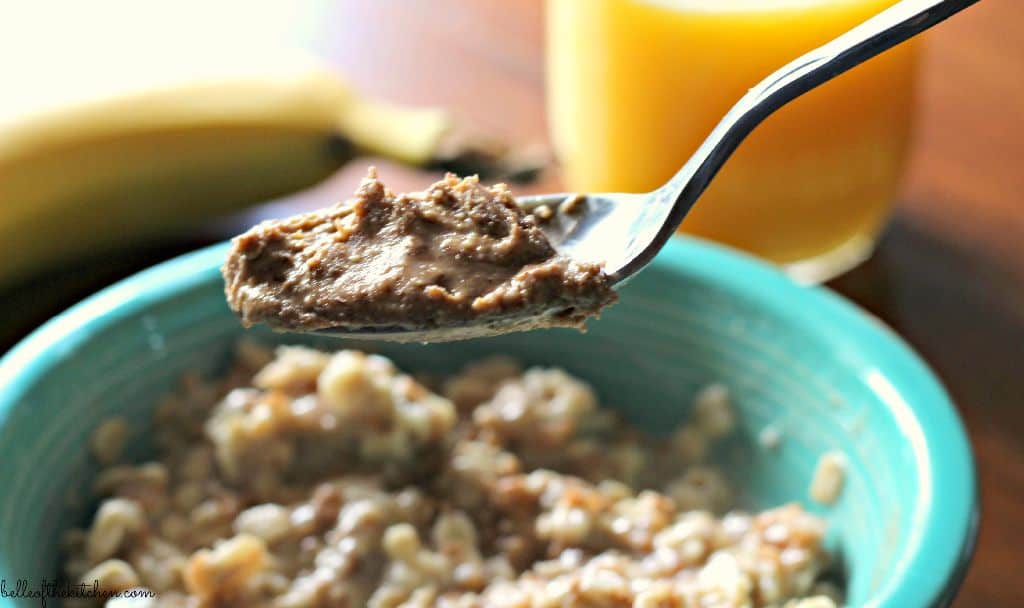 A bowl spoon full of oatmeal