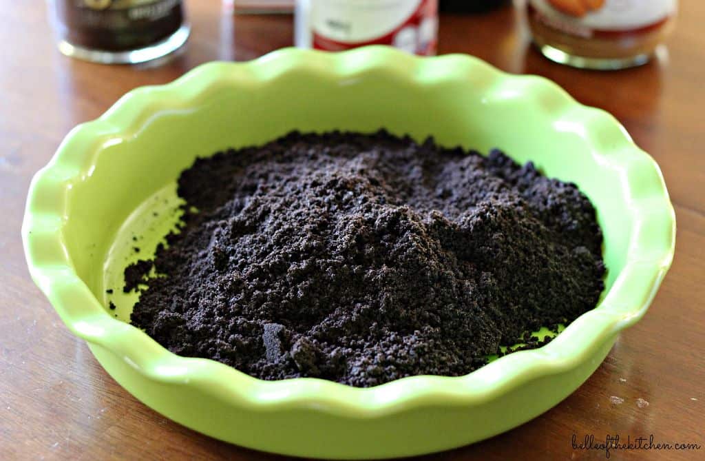 a pie dish full of Oreo crumbs