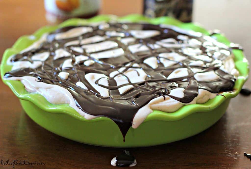 a pie dish full of ice cream and chocolate sauce