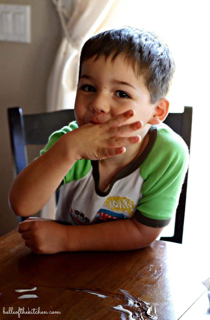 A little boy sitting at a table