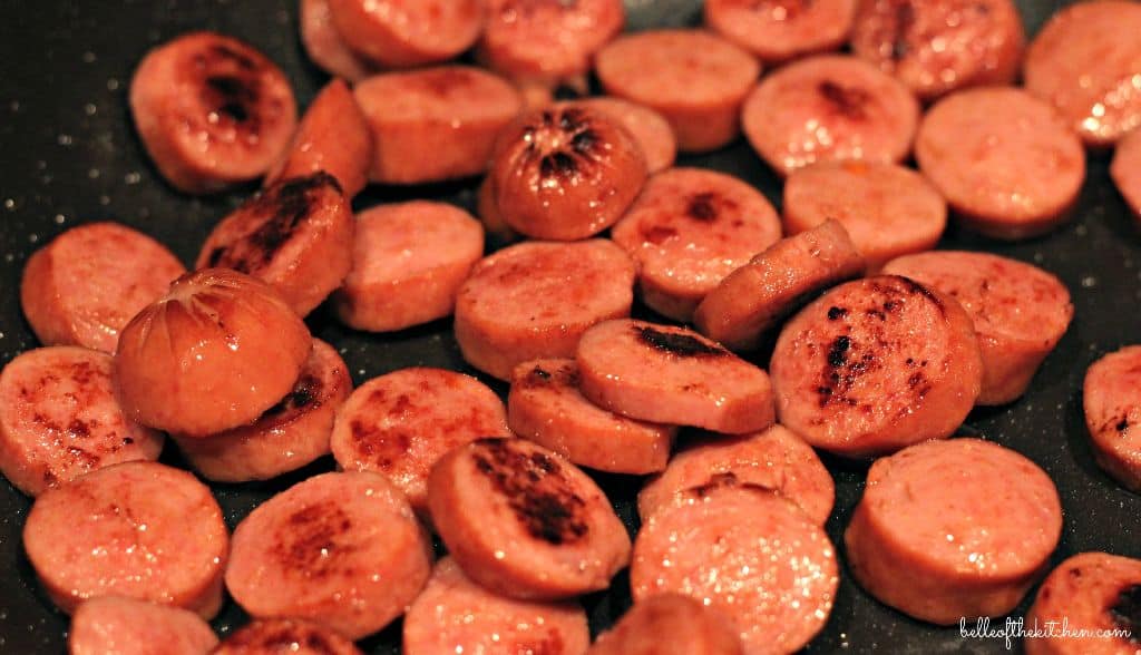 sausage cooking in a pan