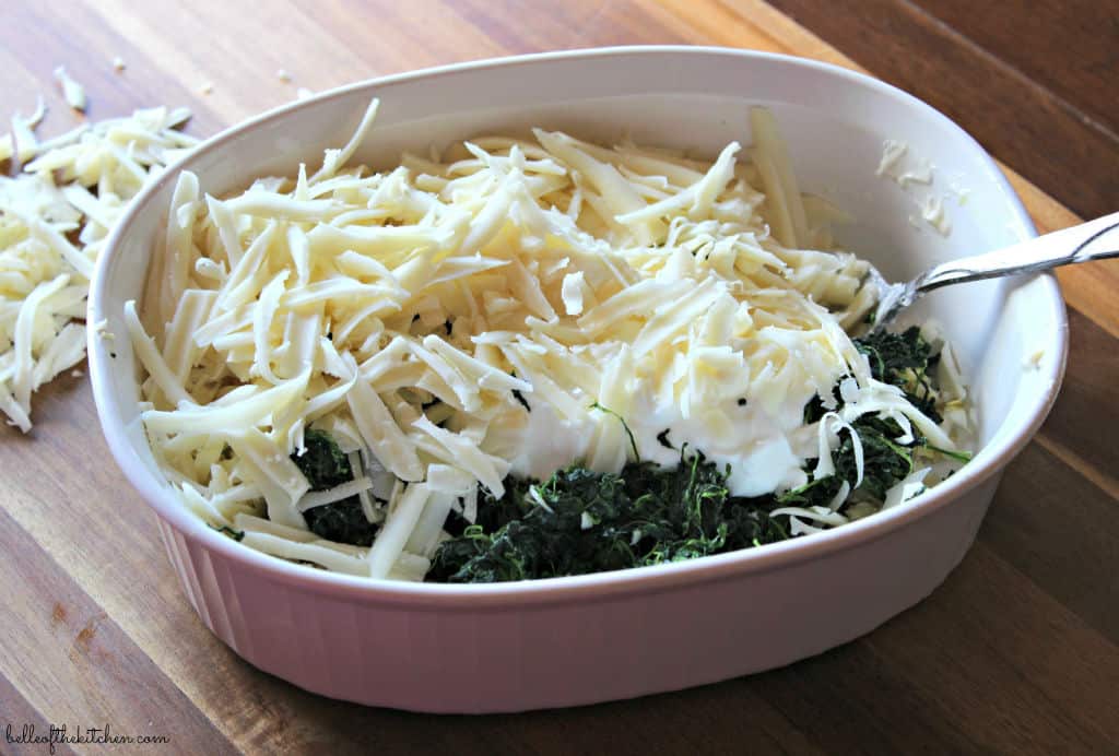 A bowl of spinach, artichokes, and cheese