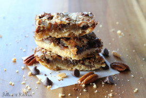 a stack of chocolate pecan pie bars