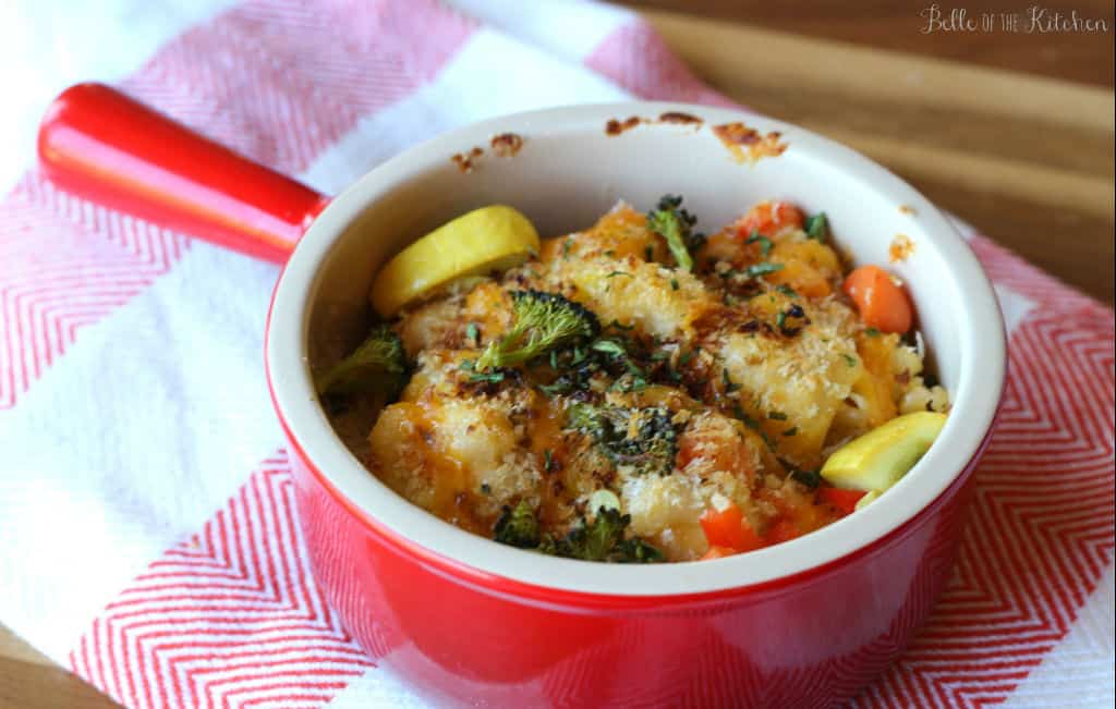 a bowl of macaroni and cheese with veggies