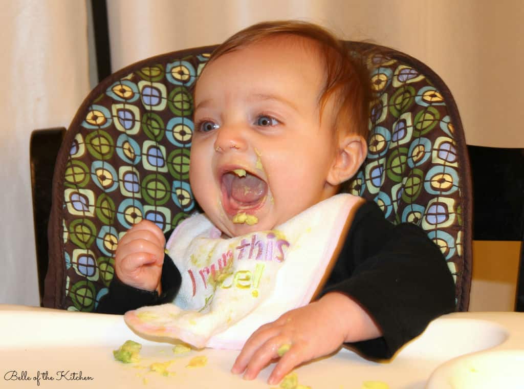 A baby sitting in a high chair