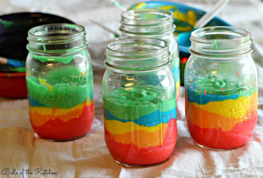 jars full of different colored cake layers