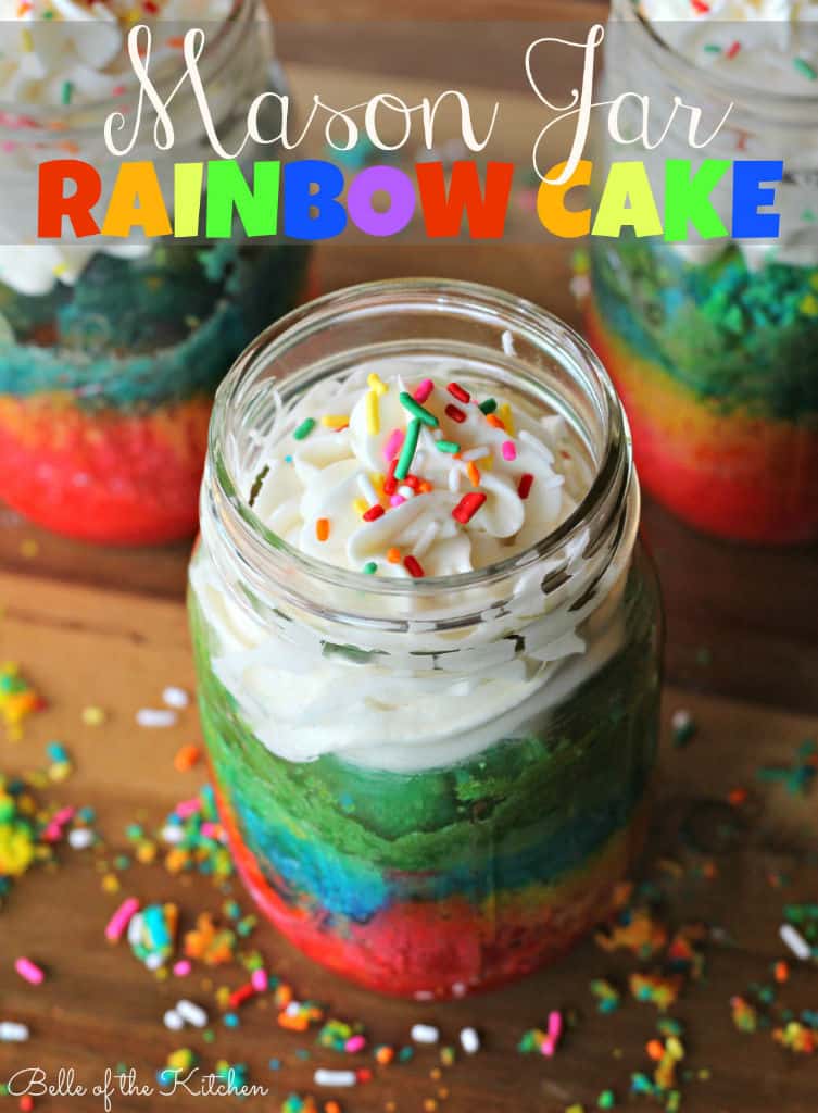 cake in a jar with frosting on top and sprinkles