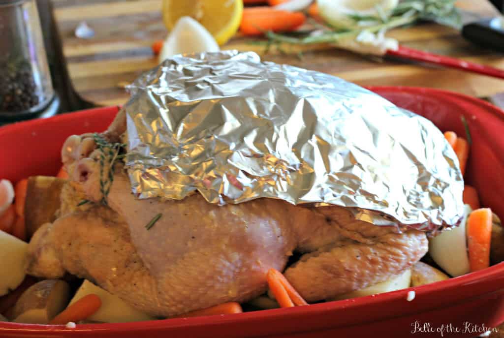 a whole chicken covered with foil
