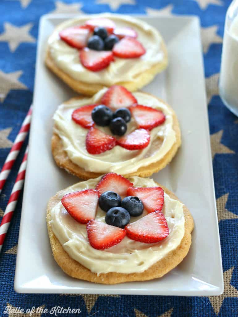 mini fruit pizzas on a white plate