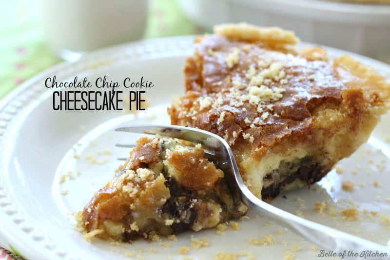 a fork digging into a piece of cheesecake pie