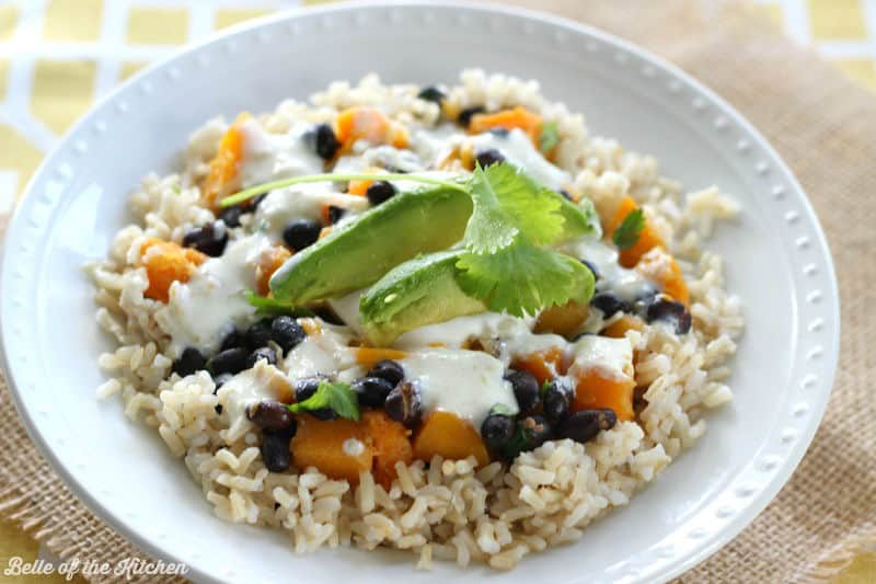 a bowl of rice with veggies and avocado