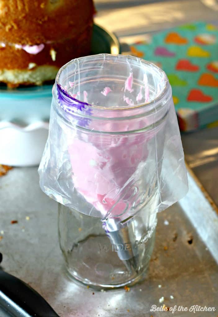 a large mason jar with frosting inside