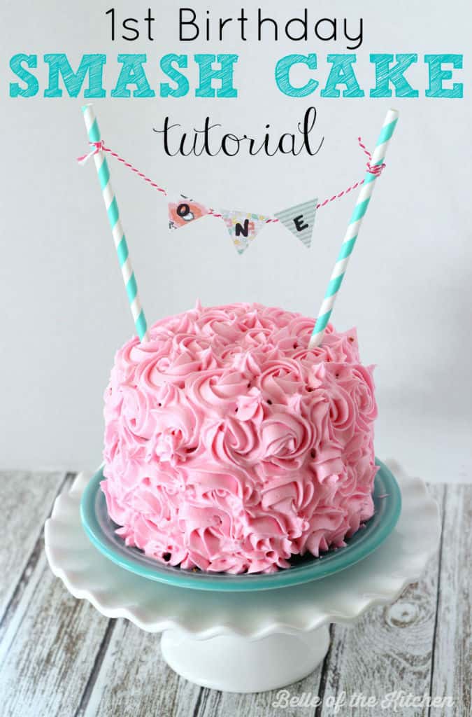 A plate with a pink frosted birthday cake