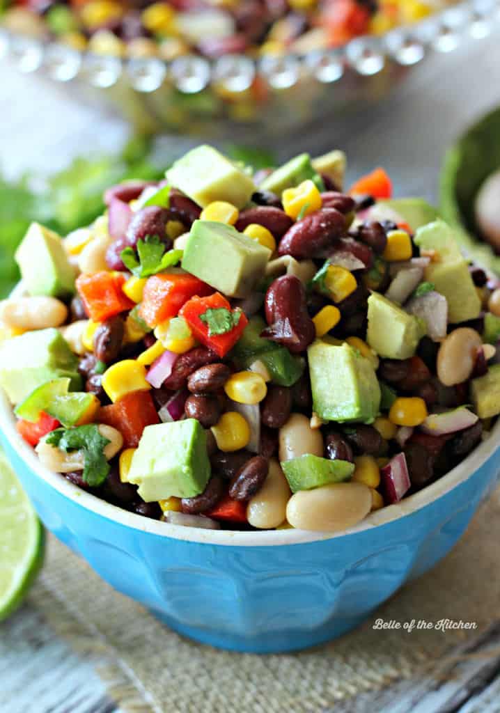 A bowl of bean salad with diced avocado