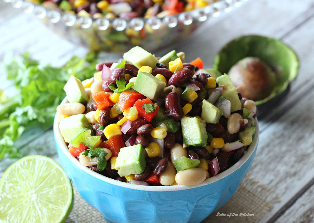 A bowl of bean salad with diced avocado