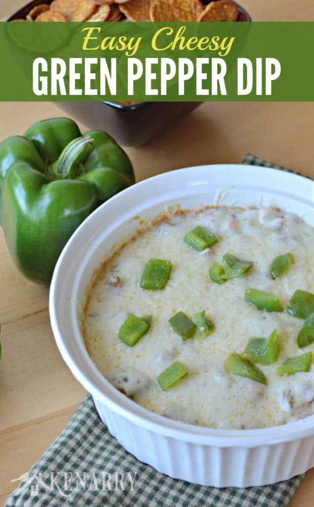 a bowl of cheese dip topped with green peppers