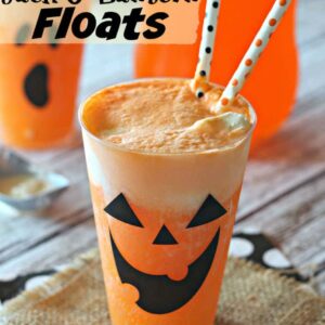 cups filled with Fanta, vanilla ice cream, and jack o'lantern faces on the side of the cups