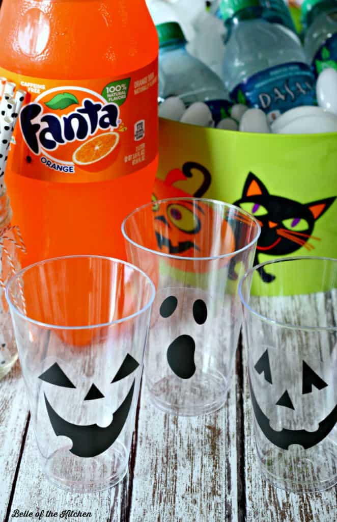 empty cups with jack o\'lantern faces on the side