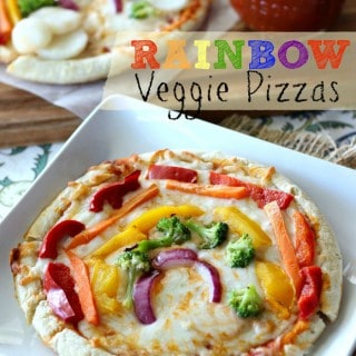 These Rainbow Veggie Pizzas are a fun way to get your kids involved in the kitchen, all while getting them excited to eat more veggies!
