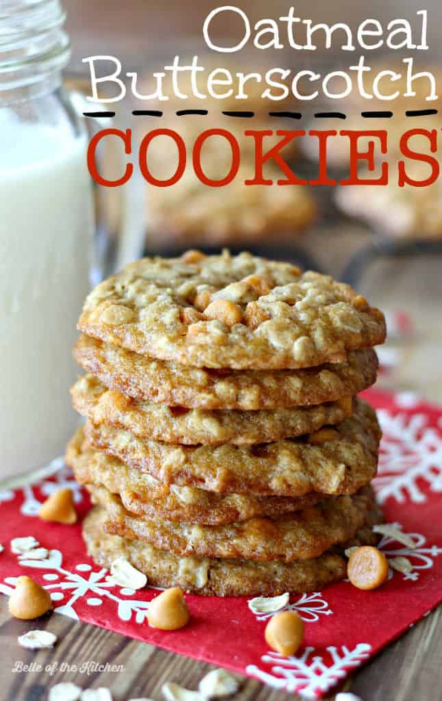 A close up of a stack of oatmeal cookies next to a glass of milk