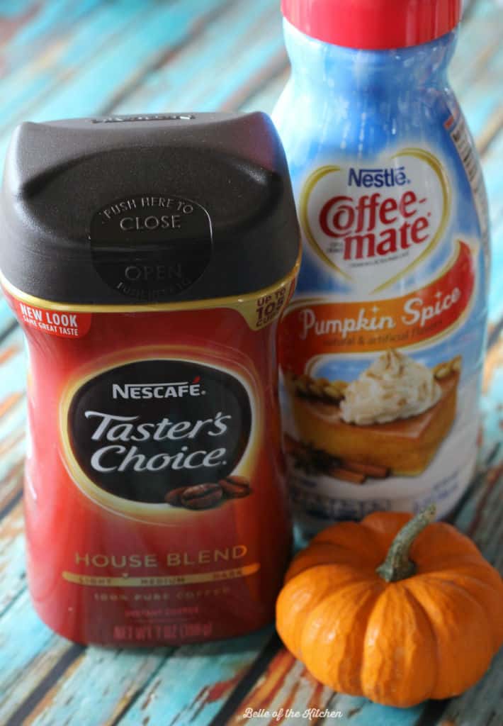 a package of coffee next to a container of pumpkin creamer