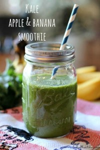 A close up of a glass filled with a green smoothie