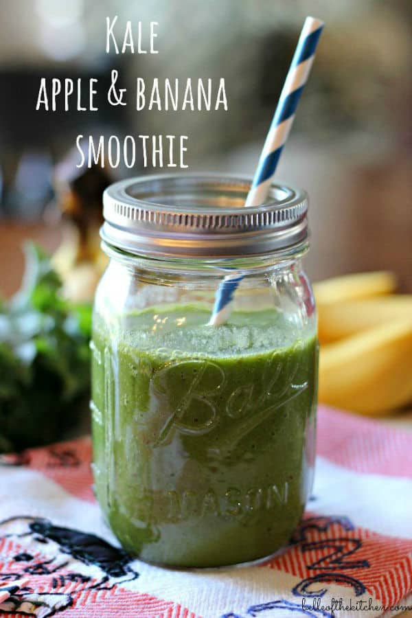 A close up of a mason jar filled with a green smoothie