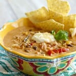 Peppers, onions, and creamy cheese come together to make this delicious Chicken Fajita Soup. Topped off with a little sour cream and chips on the side, this is a bowl of southwest comfort food!