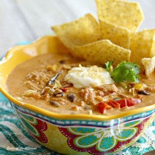 Peppers, onions, and creamy cheese come together to make this delicious Chicken Fajita Soup. Topped off with a little sour cream and chips on the side, this is a bowl of southwest comfort food!
