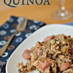 A plate of food filled with sausage and quinoa