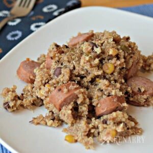 A plate of food with sausage and quinoa