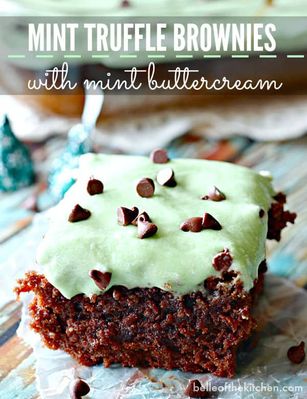 A close up of a piece of chocolate brownies topped with mint frosting and chocolate chips