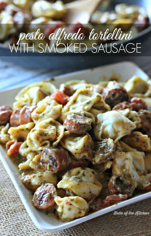 A plate filled with tortellini and sausage