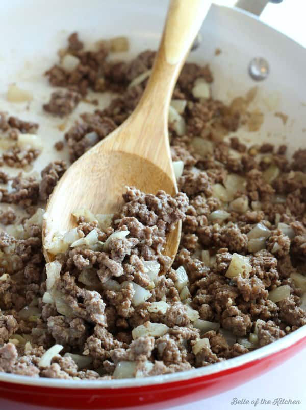 A skillet filled with ground beef and onions