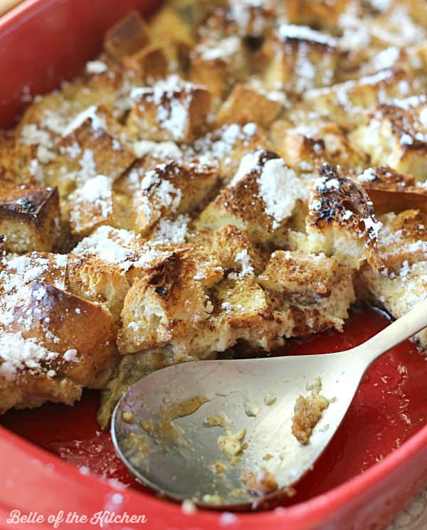 A dish of French toast casserole with a spoon