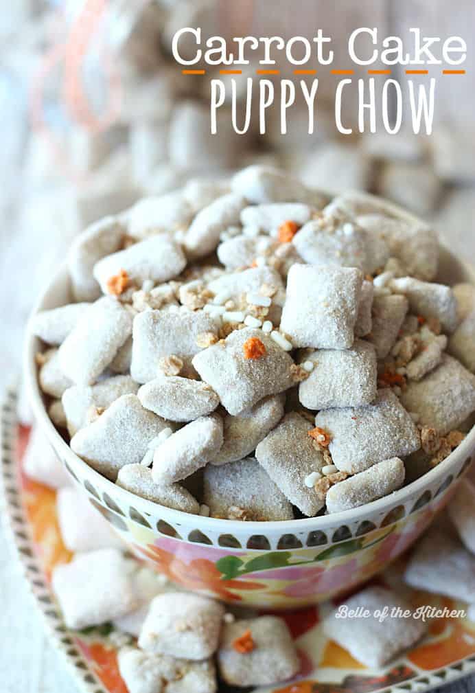 A close up of a bowl of carrot cake puppy chow topped with orange and white sprinkles