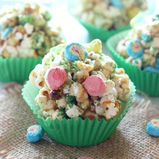 Make St. Patrick's Day even more fun with these yummy Popcorn Balls! They are full of sprinkles, marshmallow charms cereal, and are easy to make for St. Patrick's Day or any day of the year!