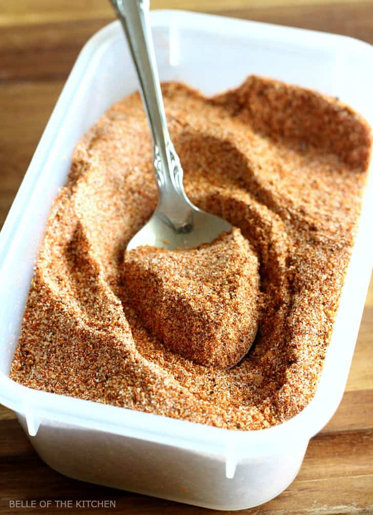 A bowl of bbq seasoning with a spoon inside