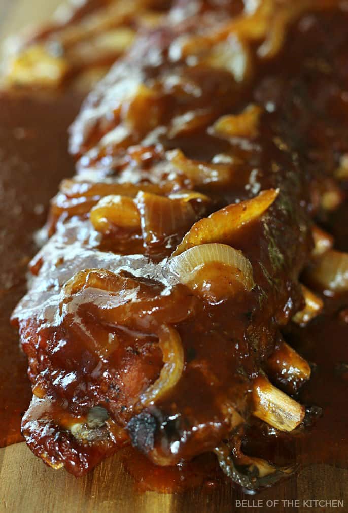 A close up of ribs on a cutting board