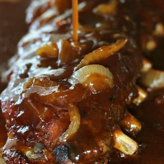 These Crockpot BBQ Ribs are deliciously easy! Made with a homemade rub, sliced onions, and barbecue sauce, these are seriously finger-lickin' good!
