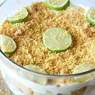 Key Lime Cheesecake Trifle - An easy and pretty dessert made with layers of graham cracker crust, cubed pound cake, and a key lime cheesecake filling.