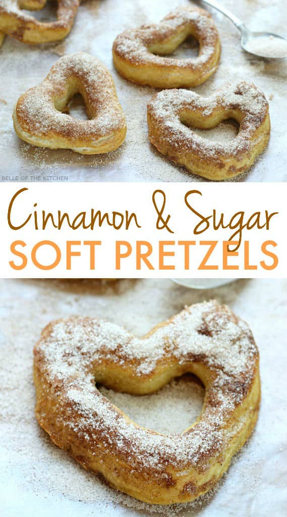 soft pretzels in the shape of hearts on a sheet pan topped with sugar