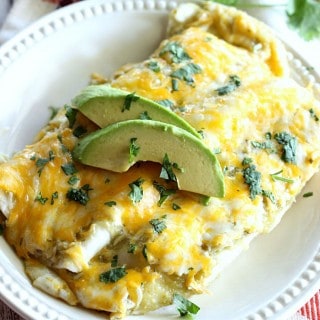 These Salsa Verde Chicken Enchiladas are made with a creamy and delicious filling, and smothered with cheese. They will kick any Mexican food craving!