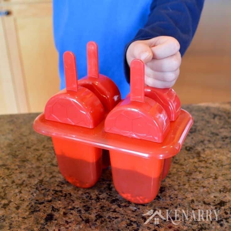 A red popsicle mold