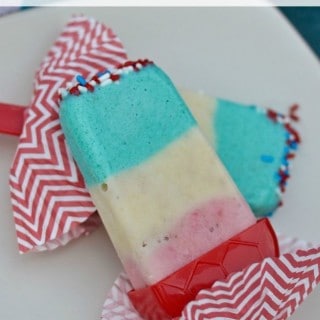 The kids will love these Patriotic Pudding Popsicles made with bananas, Greek yogurt and strawberries! They'd be perfect for 4th of July, Memorial Day, Labor Day or a mid-summer poolside treat.