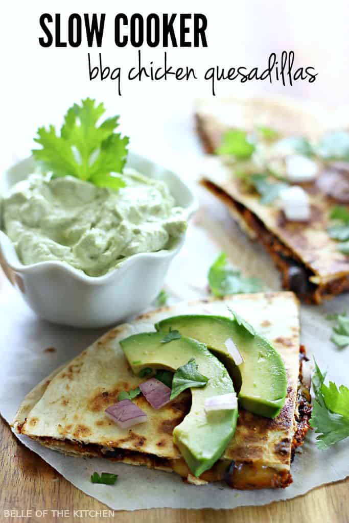 a quesadilla topped with avocado next to a bowl of avocado cream