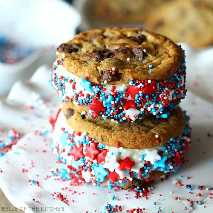 A close up of a stack of ice cream sandwiches covered in red, white, and blue sprinkles on a plate