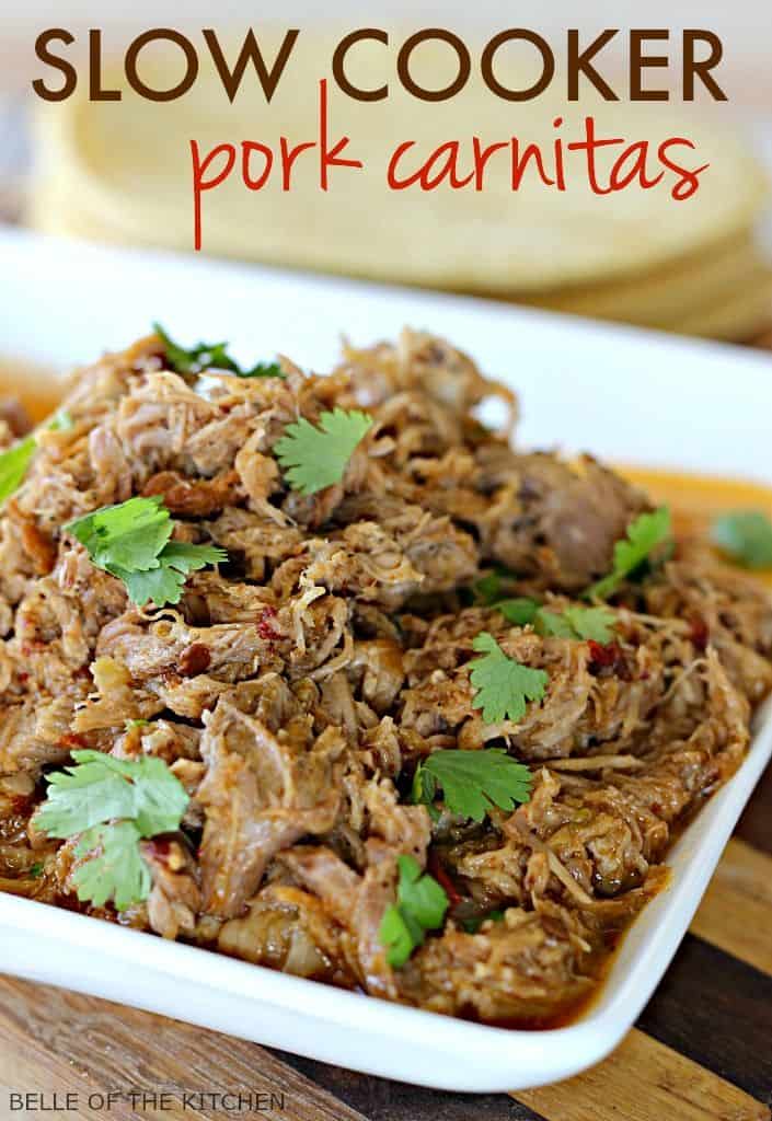 A dish is filled with shredded pork, topped with cilantro