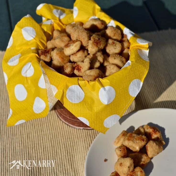 A bowl of chicken nuggets on top of a yellow polka dot napkin